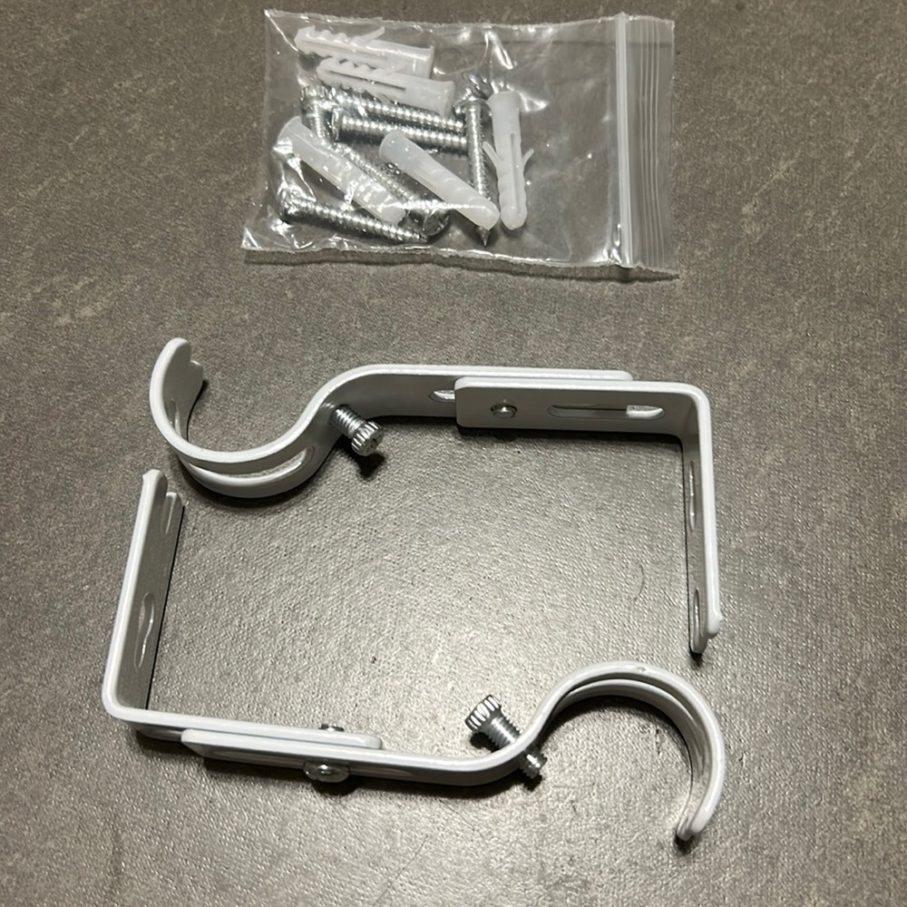 Brackets for a curtain rod